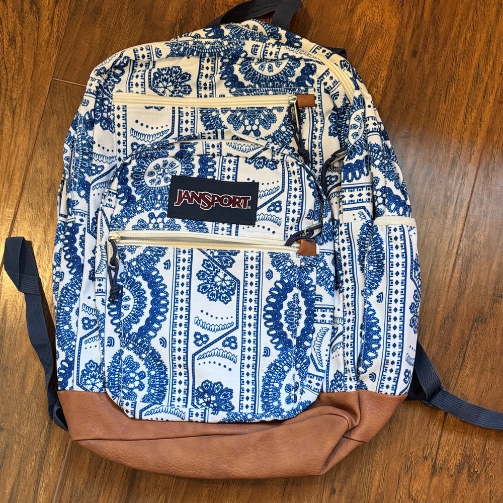 JanSport White and Blue Patterned Backpack with Brown Accents